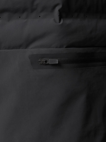 Close up of the back area highlighting a horizontal zippered pocket with a matte pull on the Zone Training LVS Insulated Gilet