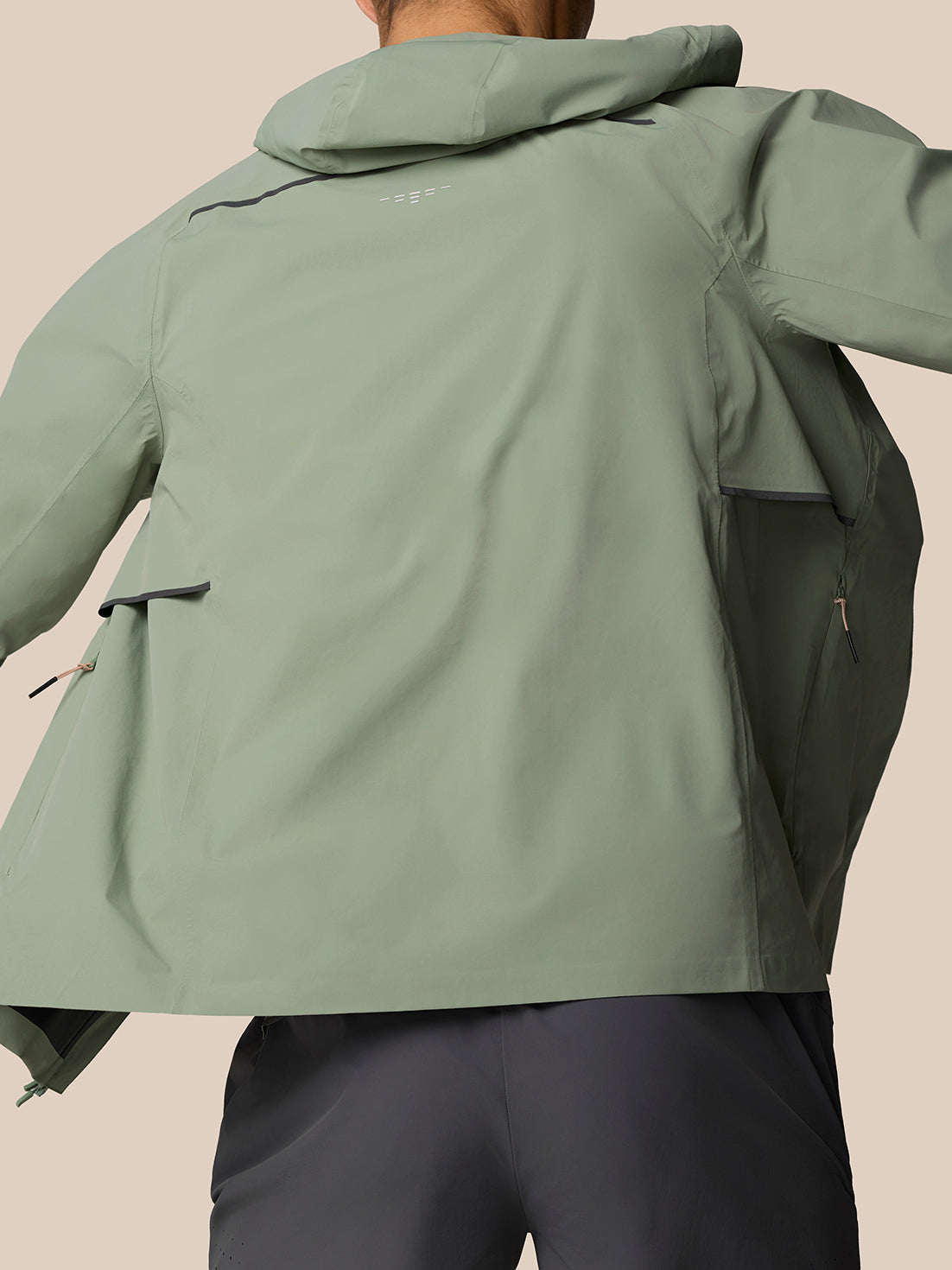 Back view of Zone Training LVS Jacket Thyme showing hood and vent details.