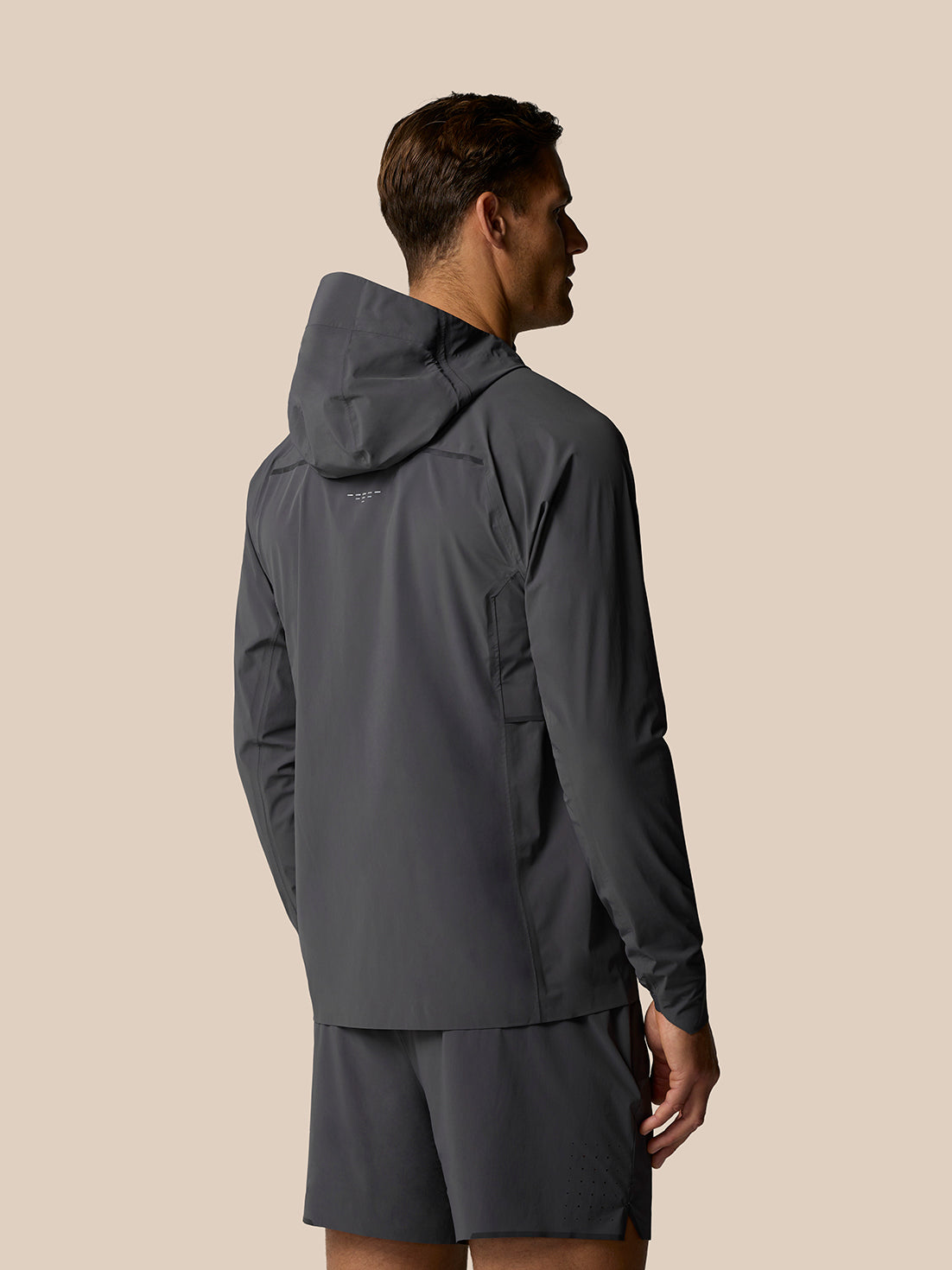 Back view of Zone Training LVS Jacket on a male model highlighting the hood and vent design