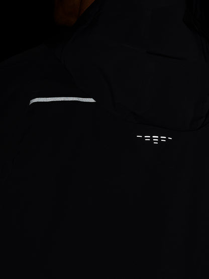 Back view of Zone Training LVS Jacket in gunmetal black showing a reflective stripe on the sleeve and ventilation marks on the back.