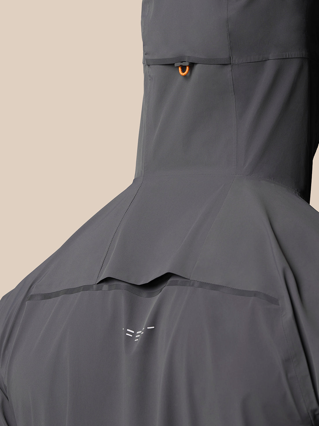 Back view of the Gunmetal/Black Reflective Zone LVS Jacket hood showing orange loop detail at the collar.