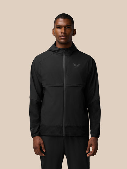 Front view of a man wearing black Flex Winterised Woven Jacket with hood and left chest logo