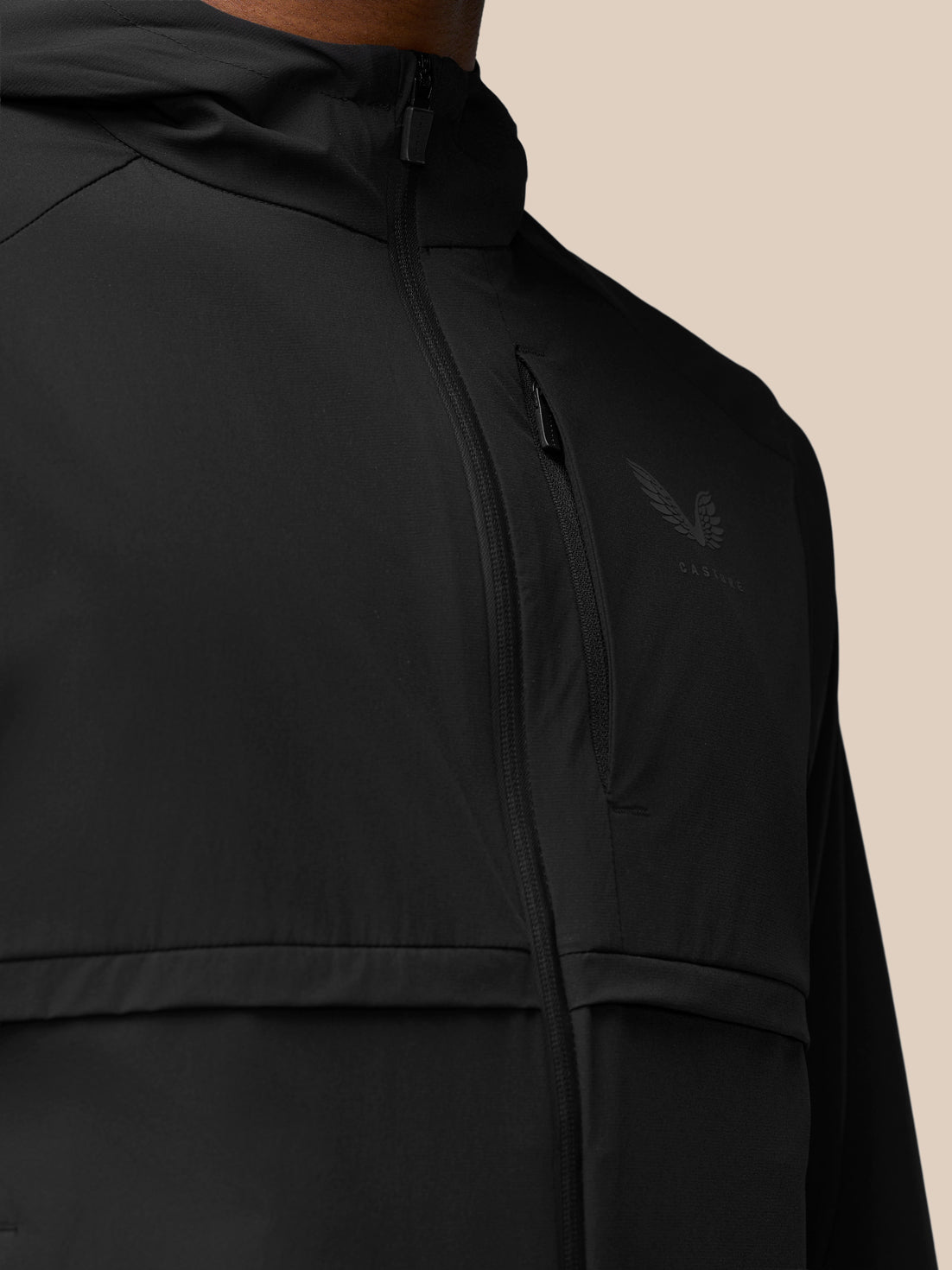 Front close-up of black Flex Winterised Woven Jacket with vertical chest zipper and chest pocket