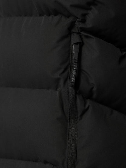 Close up of black puffer vest zipper with ProTek branding