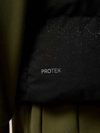 Close up of black ProTek fabric with water droplets on the gilet's surface