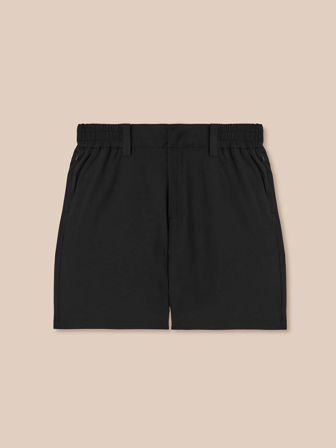 Back view of black golf shorts with elastic waistband and zip pockets.