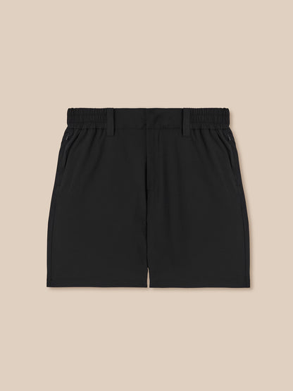 Back view of black golf shorts with elastic waistband and zip pockets.