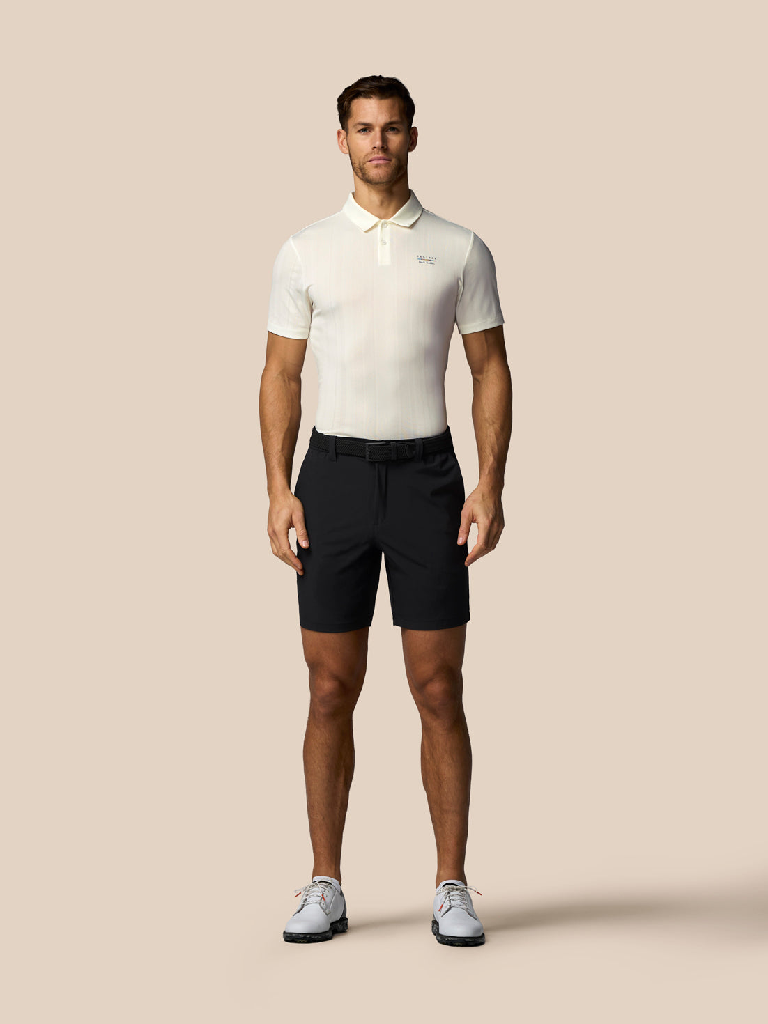 Close-up of Castore Paul Smith logo with multicolor stripe on lavender shorts