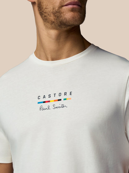 White t-shirt with 'Castore Paul Smith' logo on a beige background