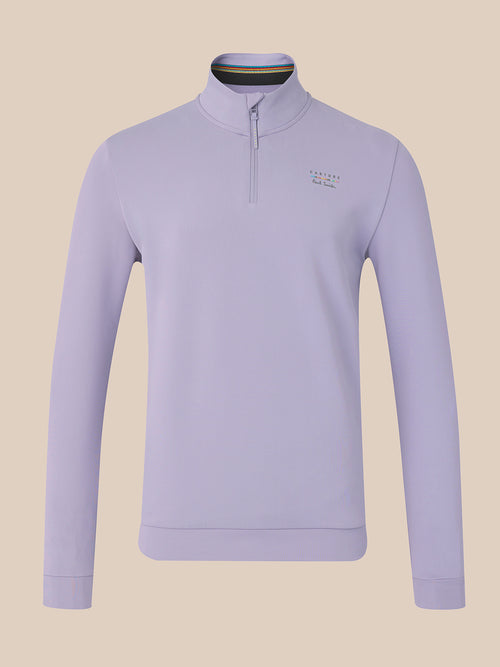 A light lavender quarter-zip pullover sweater with a small embroidered logo on the left chest, displayed on a neutral beige background.