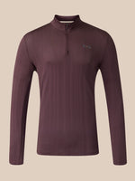 A long-sleeve quarter-zip athletic top shown from the front, in a dark plum-brown color with a small vertical multicolor logo near the upper back, set against a solid beige background.