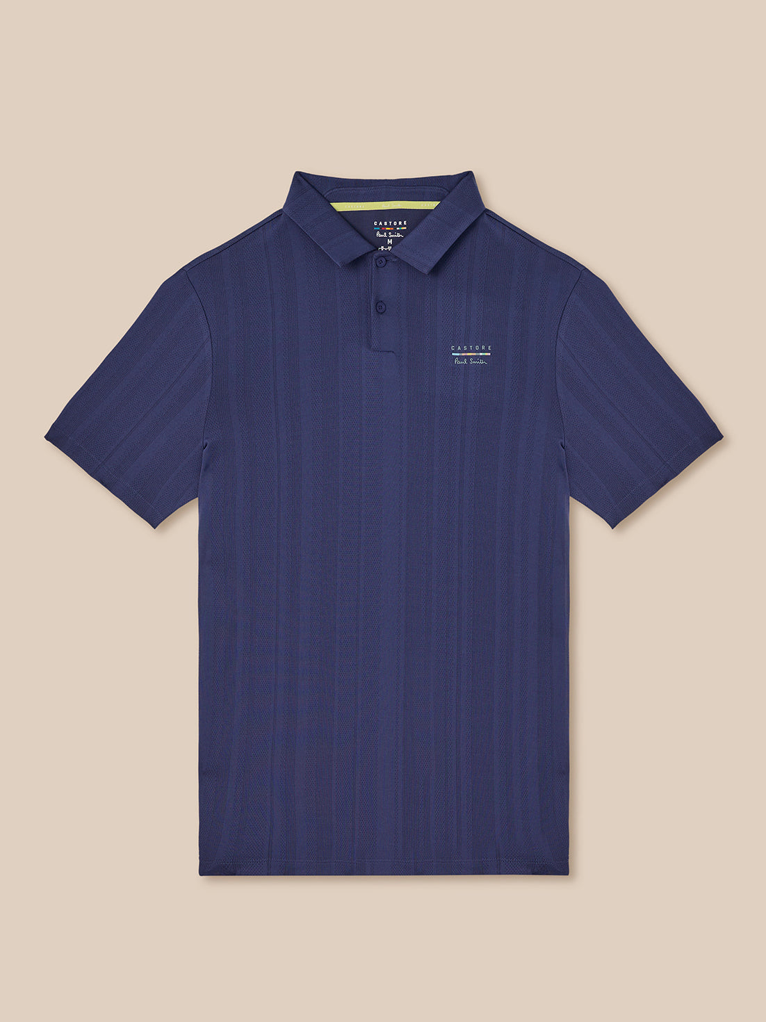 Navy knit polo with pointed collar and button placket featuring Castore x Paul Smith branding on the chest.