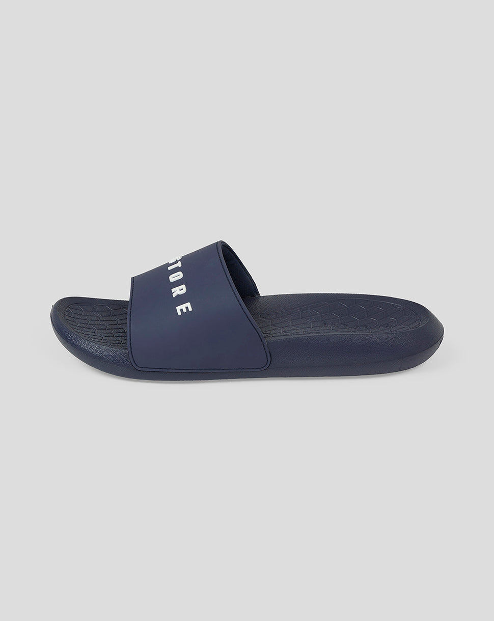 Navy Castore Active Slider shown from the side with bold logo on strap and textured footbed