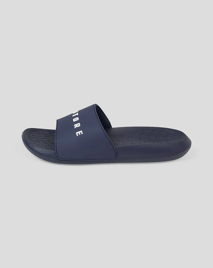 Navy Castore Active Slider shown from the side with bold logo on strap and textured footbed