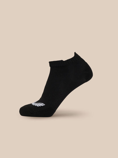 Black ankle sock with ribbed cuff and white logo near the toe