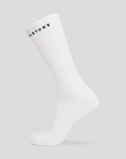 White juniors crew sock with black lettering around the ribbed cuff.