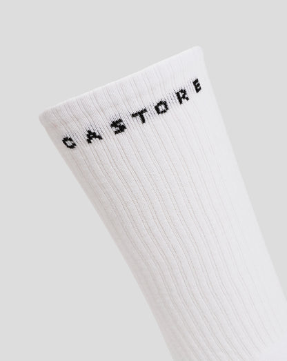 White juniors crew sock shown from a different angle with black lettering at the cuff.