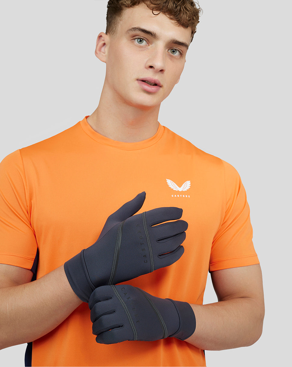 Ultra Performance Gloves in dark grey shown on a model, featuring touch screen fingertips and silicone palm grip.
