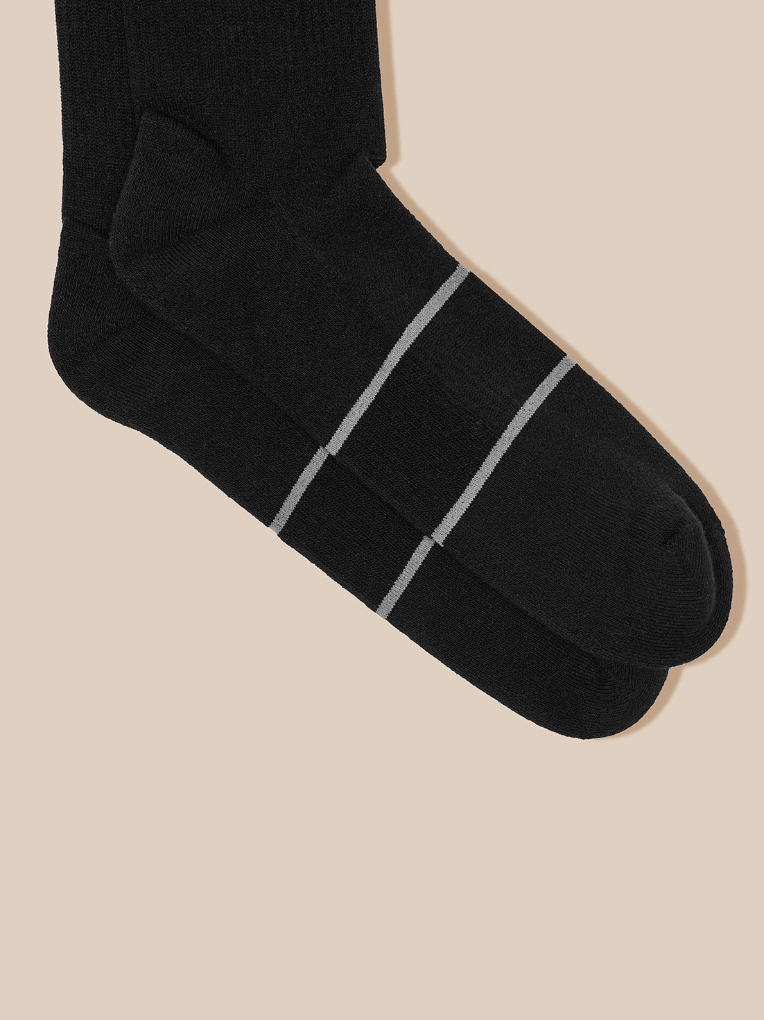 Black crew sock with two light gray stripes