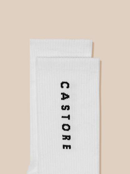 Two white crew socks folded with Castore branding visible.