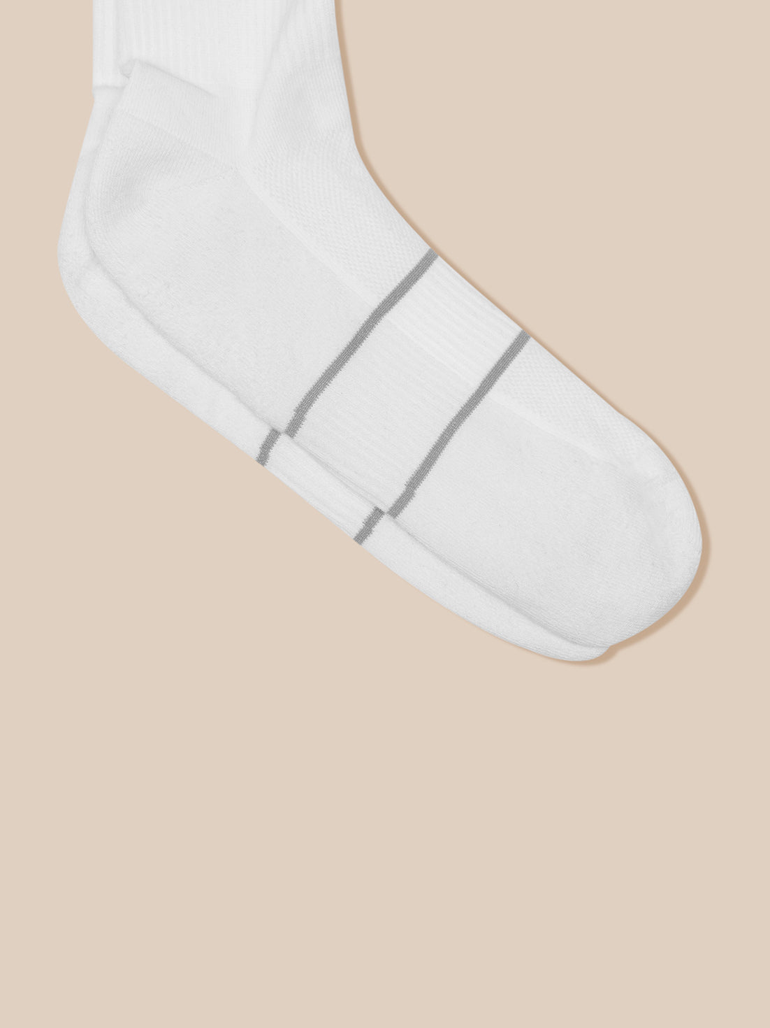 White Castore crew sock from the Active 3 Pack, showing cushioned sole and subtle gray stripe details.