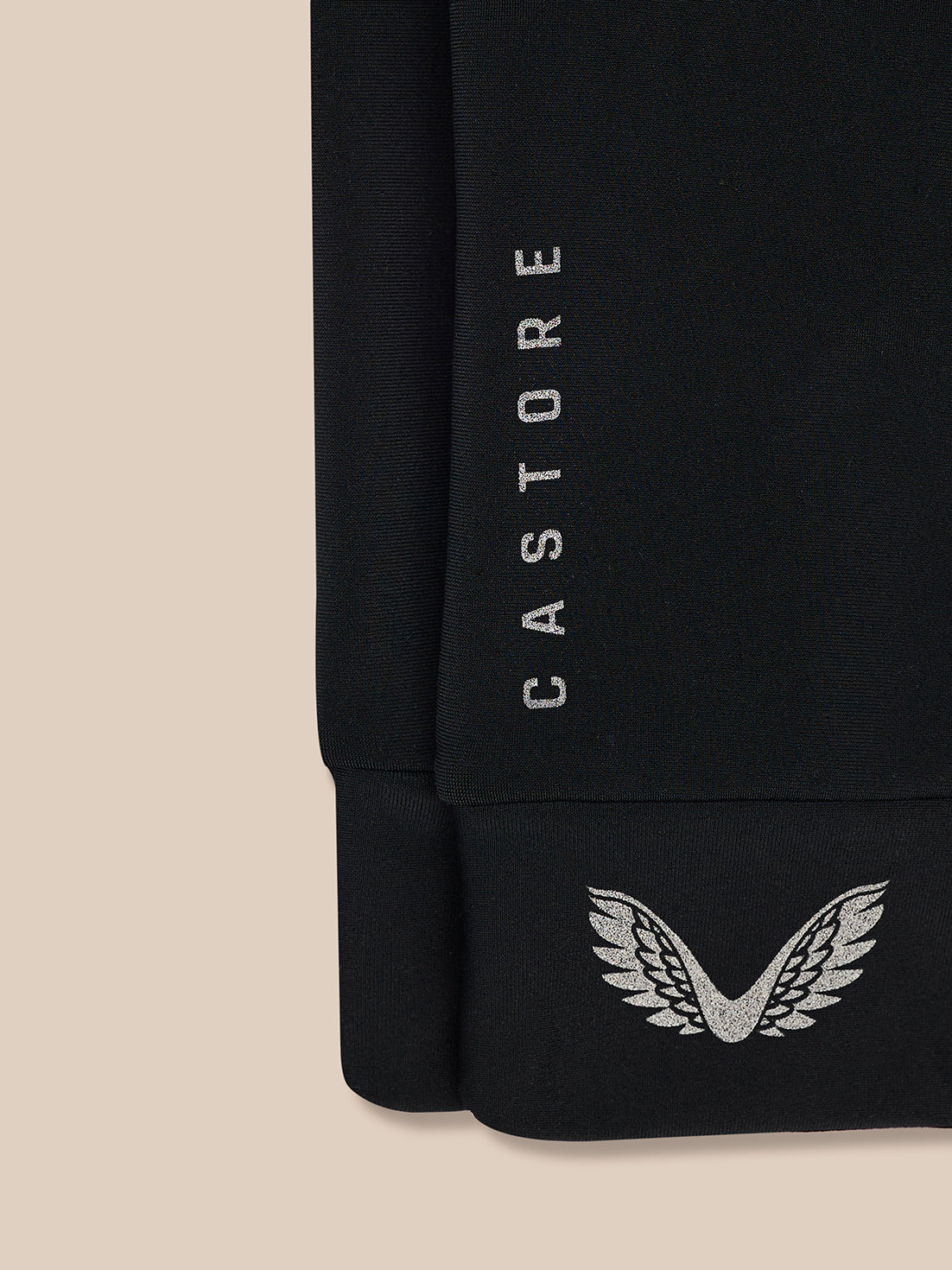 Close-up of black Pursuit Gloves cuff with vertical CASTORE branding and wing logo at the wrist