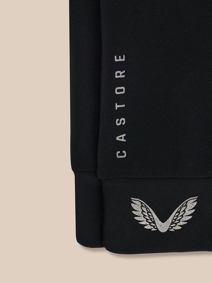 Close-up of black Pursuit Gloves cuff with vertical CASTORE branding and wing logo at the wrist