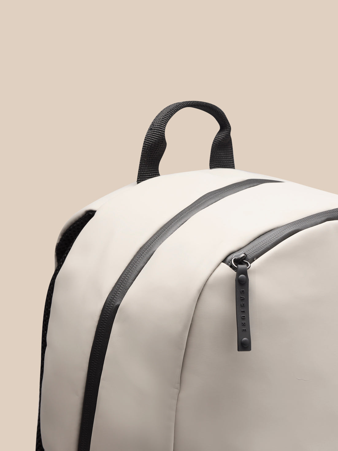 Top carry handle with zipper area and Castore branding on Rock Grey Active Backpack