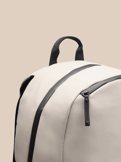 Top carry handle with zipper area and Castore branding on Rock Grey Active Backpack