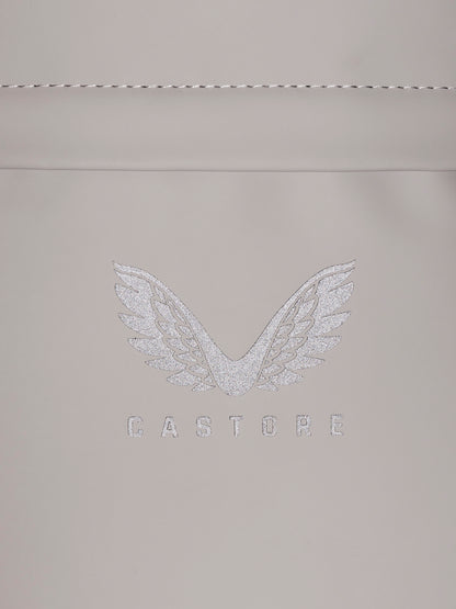 Close up of CASTORE zipper pulls on beige backpack edge