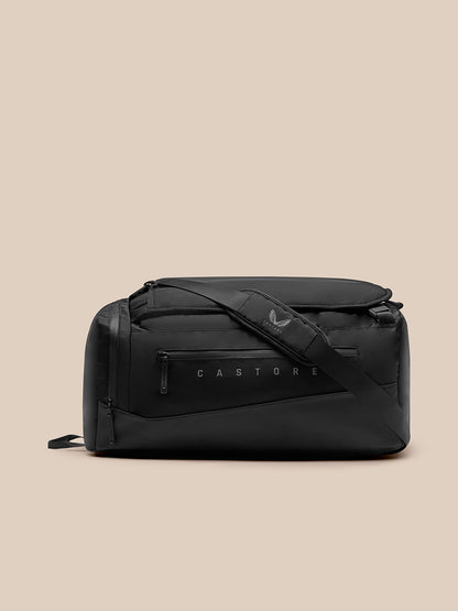 Front angled view of black Pursuit Large Backpack with crossbody strap and zippered front pocket