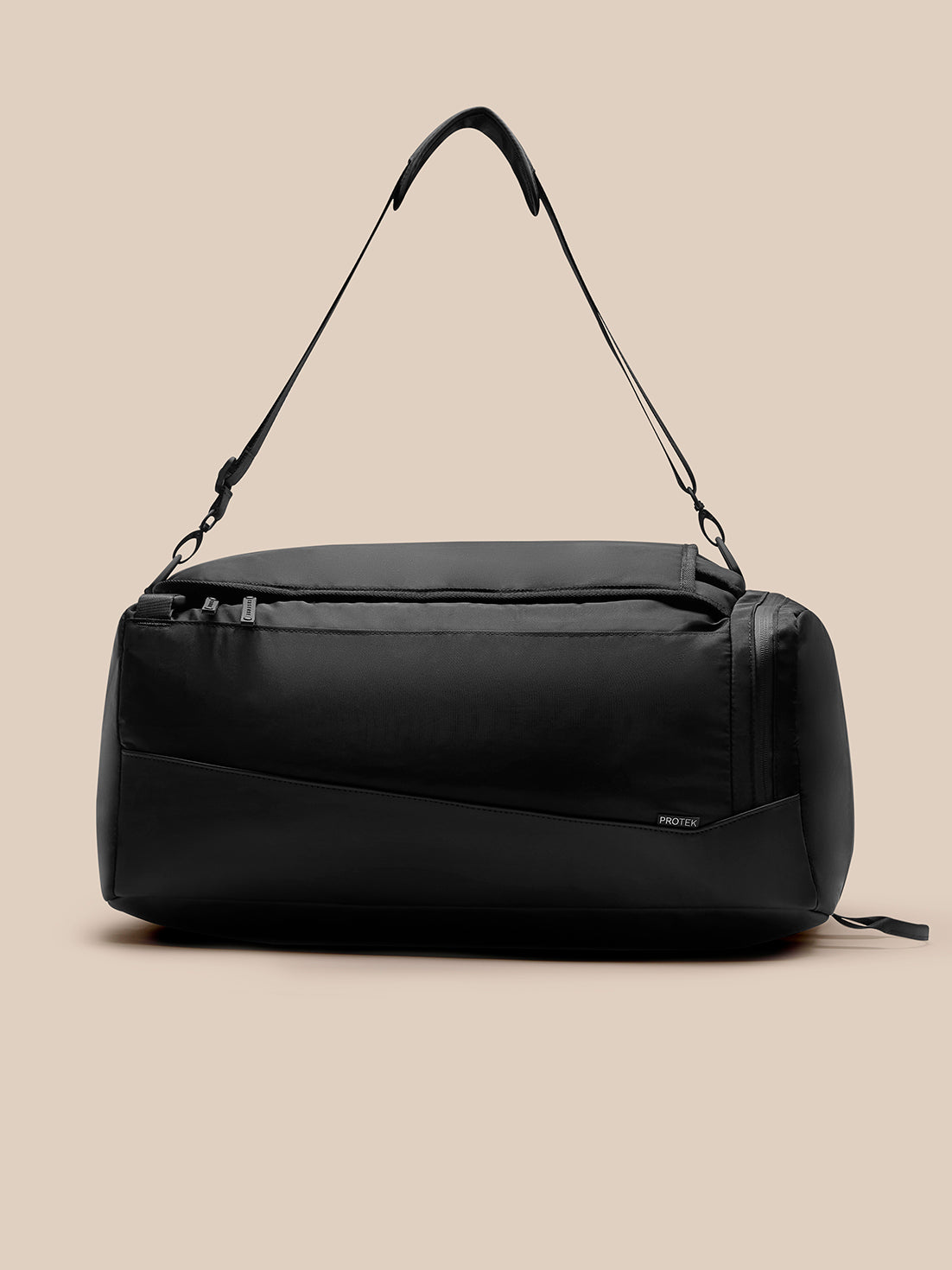 Black Pursuit Large Backpack with ProTek finish and front zip pocket on a tan background.