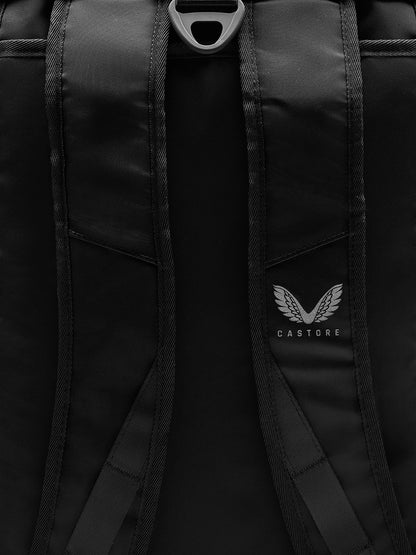 Close-up of black Pursuit backpack straps with Castore logo and textured webbing.