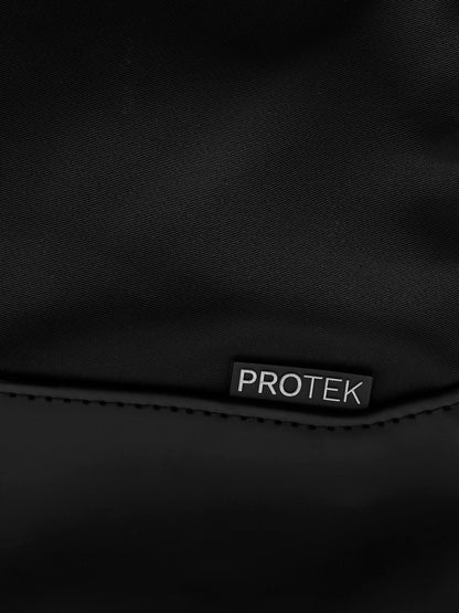 Close-up of ProTek label on the black Pursuit backpack fabric.