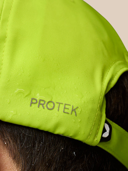 Lime green cap close-up with PROTEK branding and back closure