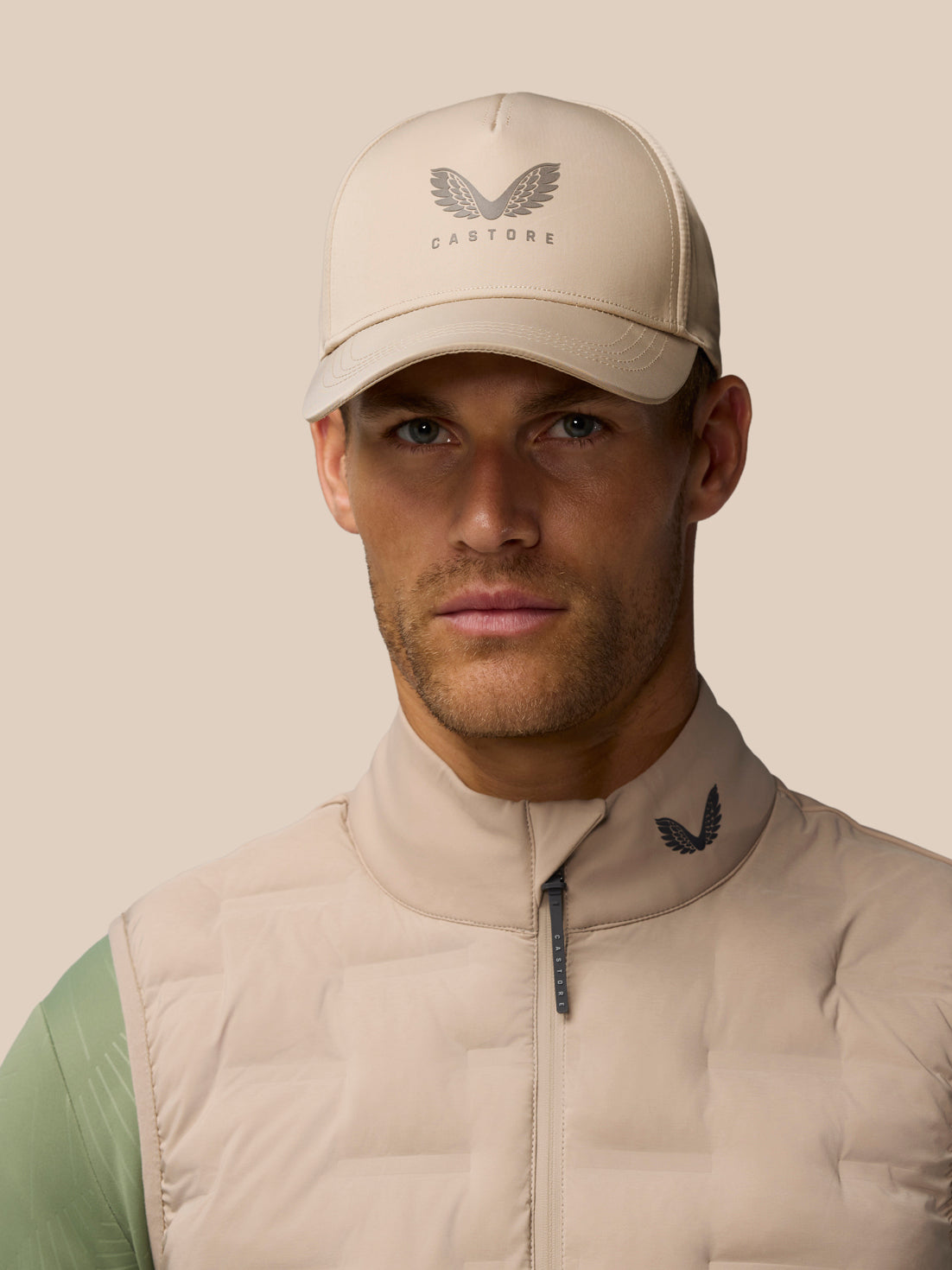 Mushroom colored Active Cap with Castore logo on front and halo eyelets for breathability.