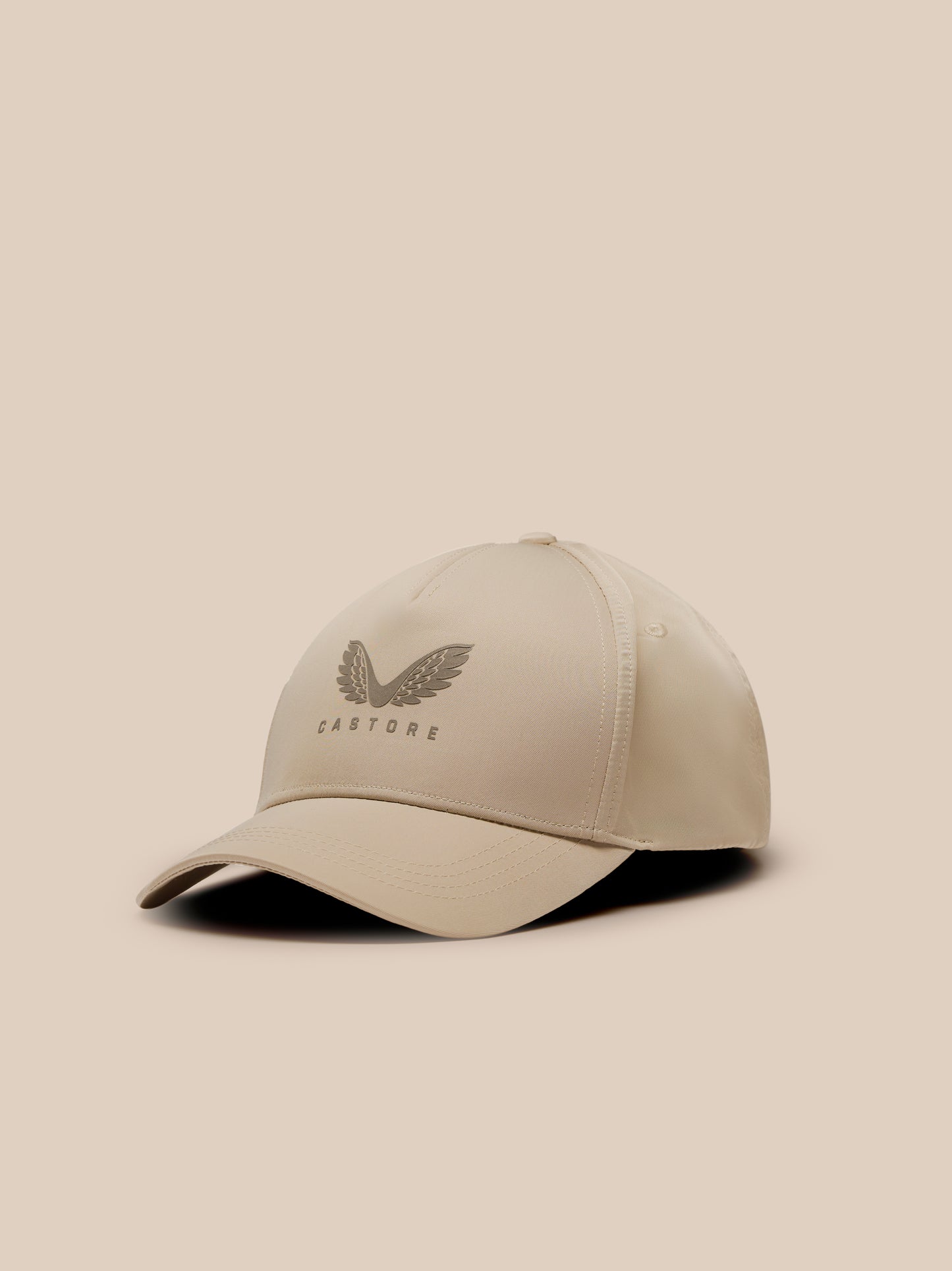 Beige mushroom cap shown from a three-quarter angle with a winged emblem on the front