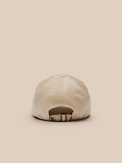 Back view of a mushroom colored cap with an adjustable strap and ProTek branding