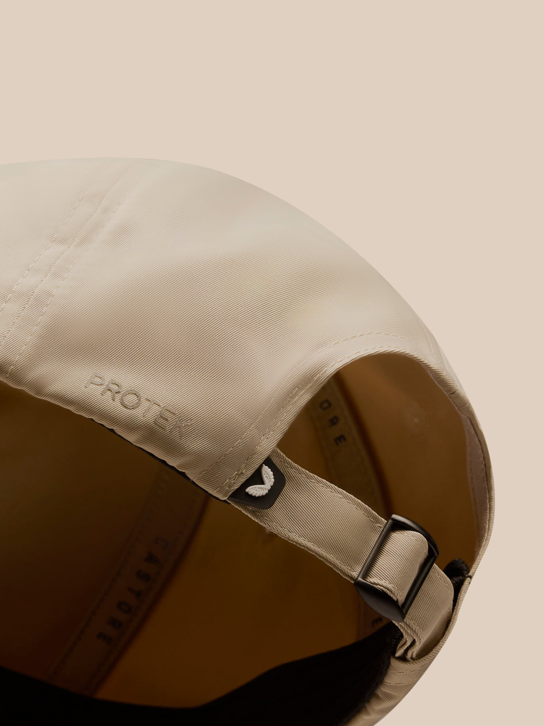 Close-up of the back of a mushroom cap showing the adjustable strap and ProTek branding