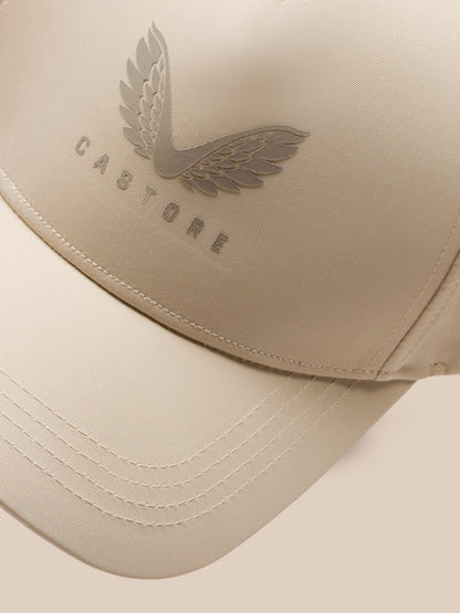 Close-up of the beige mushroom cap showing an embossed wing emblem on the crown