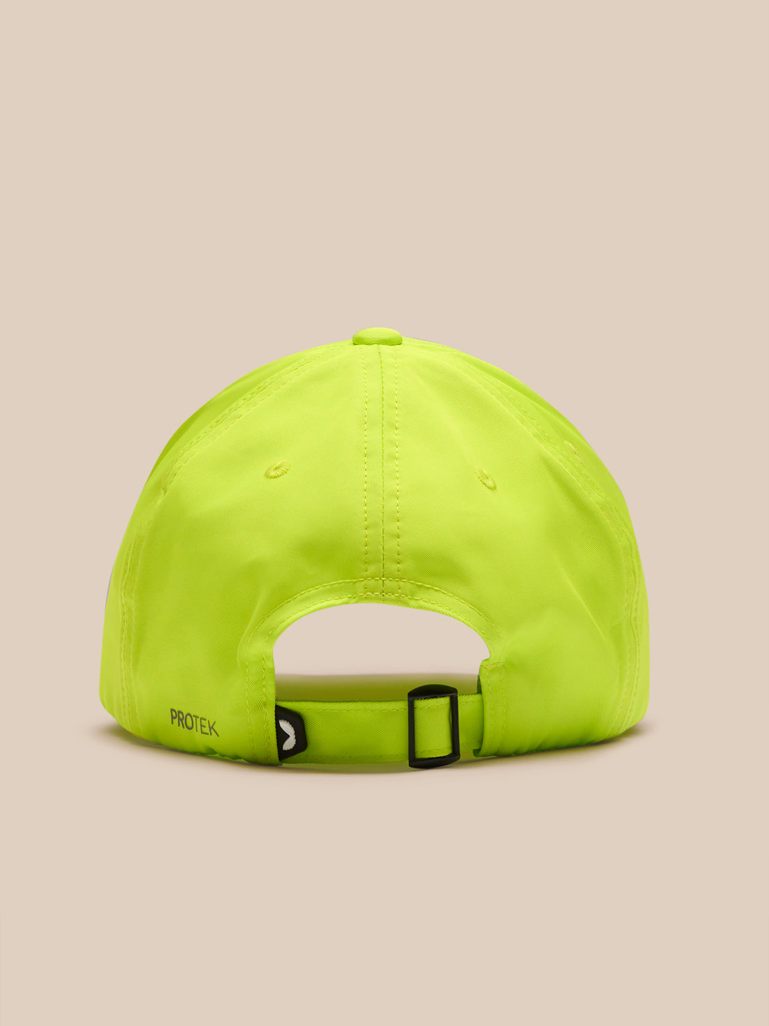 Back view of neon lime Castore Active Cap on a model, showing adjustable strap and PROTEK branding