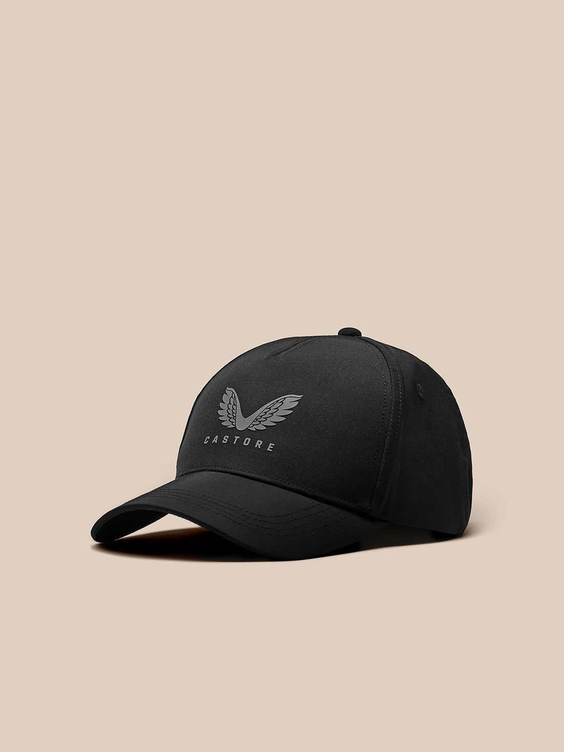 Angled front view of black Castore Cap with curved brim and logo on the front