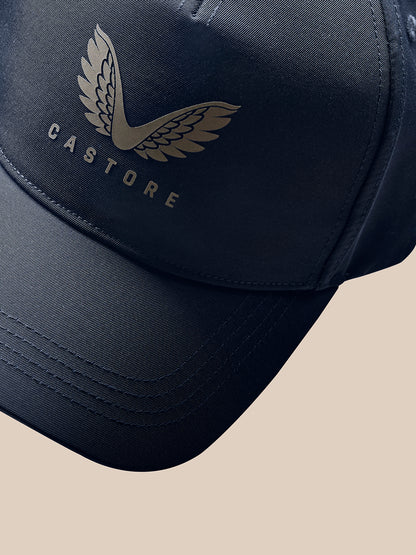 Detail of navy cap side with PROTEK branding and stitching texture
