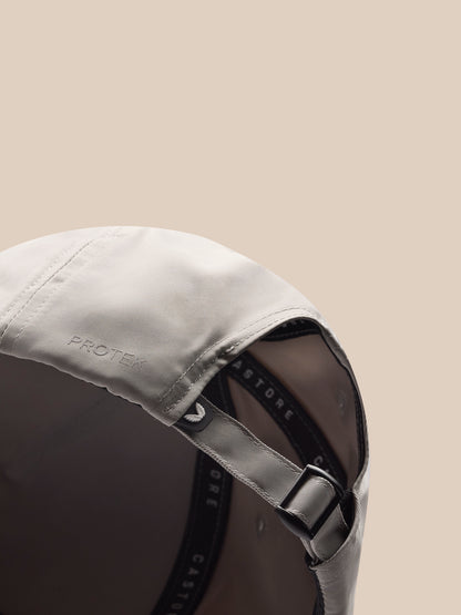 Back view close-up of a light grey cap showing the adjustable strap and Protek branding