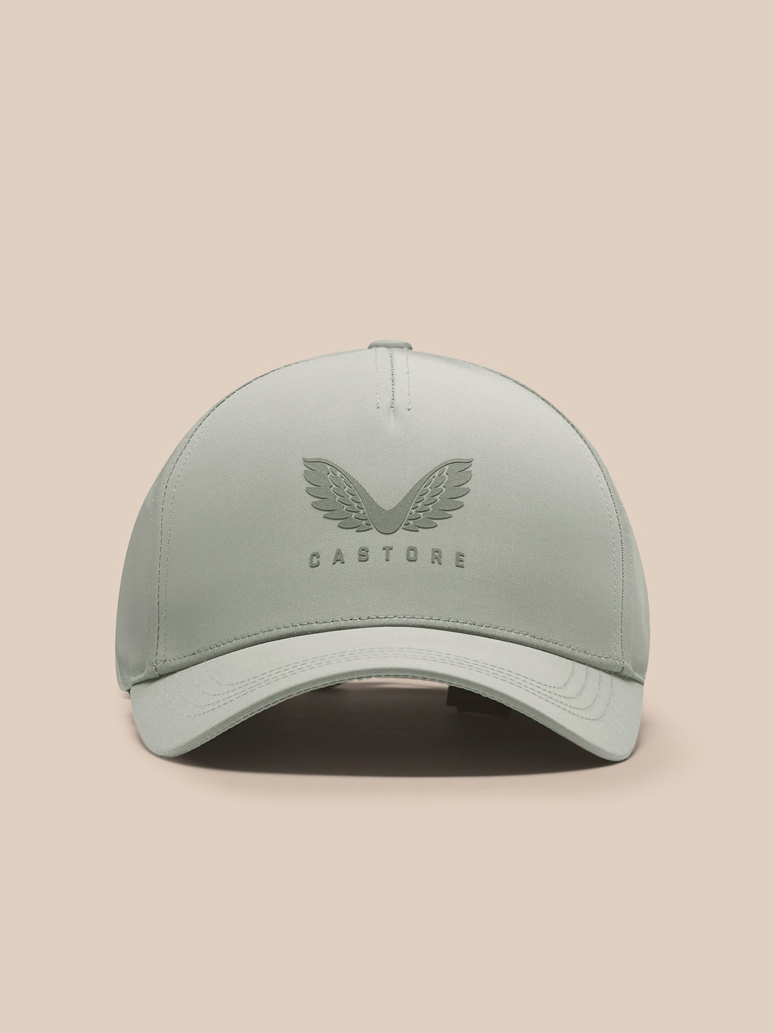Front view of sage Active Cap with Castore wing logo on the front panel and curved brim