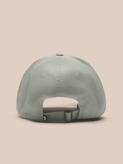 Back view of sage Active Cap showing adjustable strap and Protek branding.