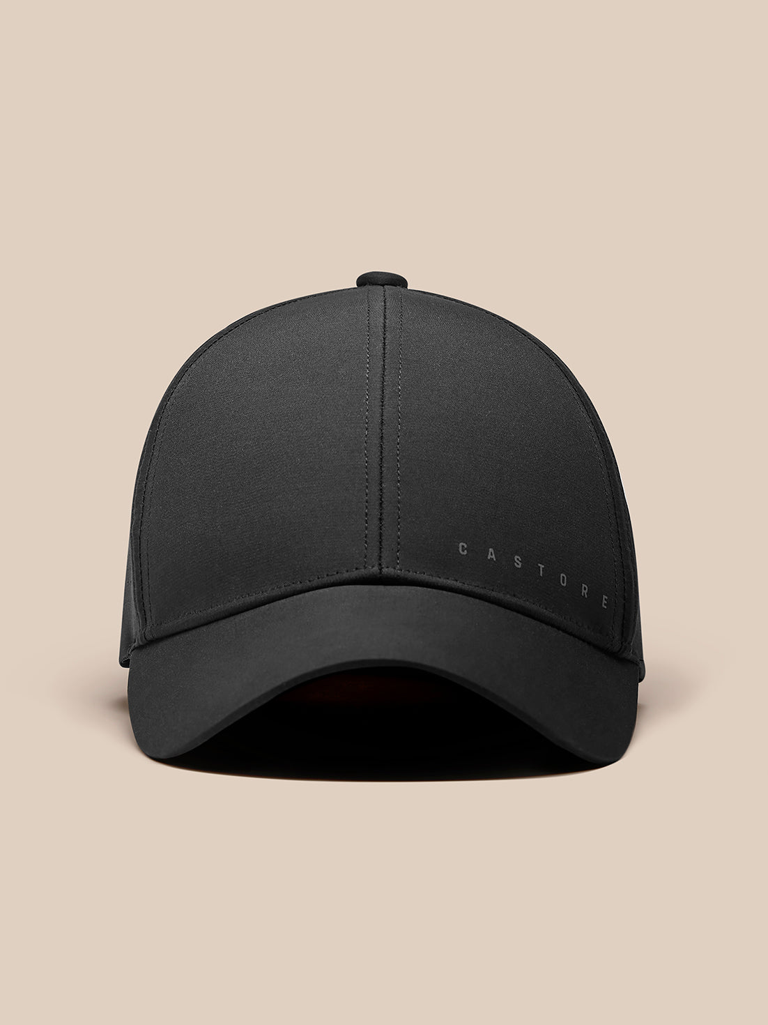 Front view of black Zone Cap with curved brim and Castore branding on the front panel