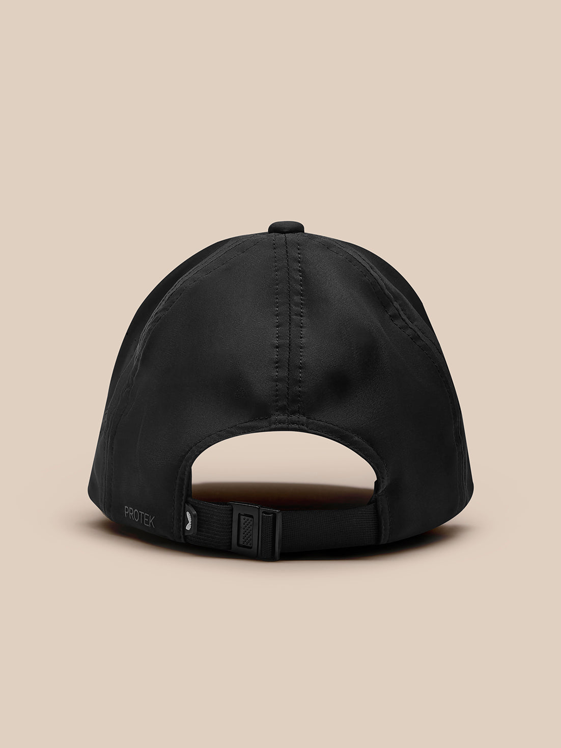 Back view of black Zone Cap with adjustable nylon strap and buckle