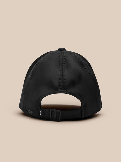 Back view of black Zone Cap with adjustable nylon strap and buckle