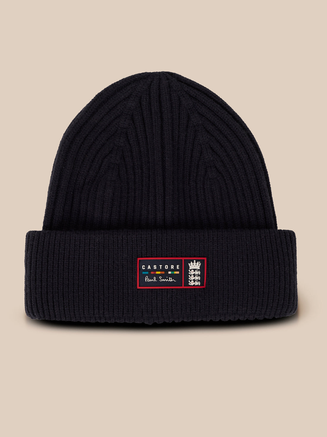 Navy knit beanie with a folded cuff and a front patch featuring Castore Paul Smith branding and the England crest.